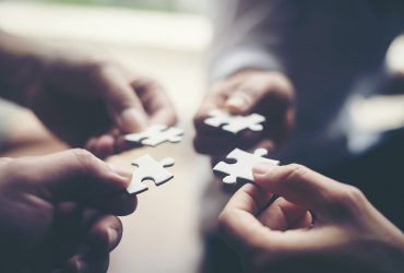 Hand holding jigsaw puzzles, Business partnership concept. Hand holding jigsaw puzzles, Business partnership concept.